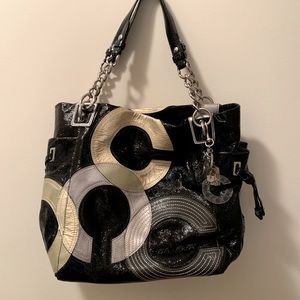 Gently loved Genuine Black Patent Leather Coach Handbag with large leather “C’s”